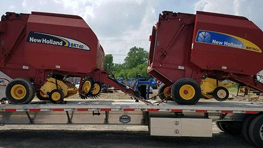 Transporting a pair of New Holland BR740A and BR70CU Balers