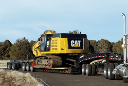 shipping an excavator on a lowboy trailer