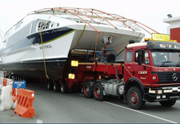 boat transport on a lowboy trailer