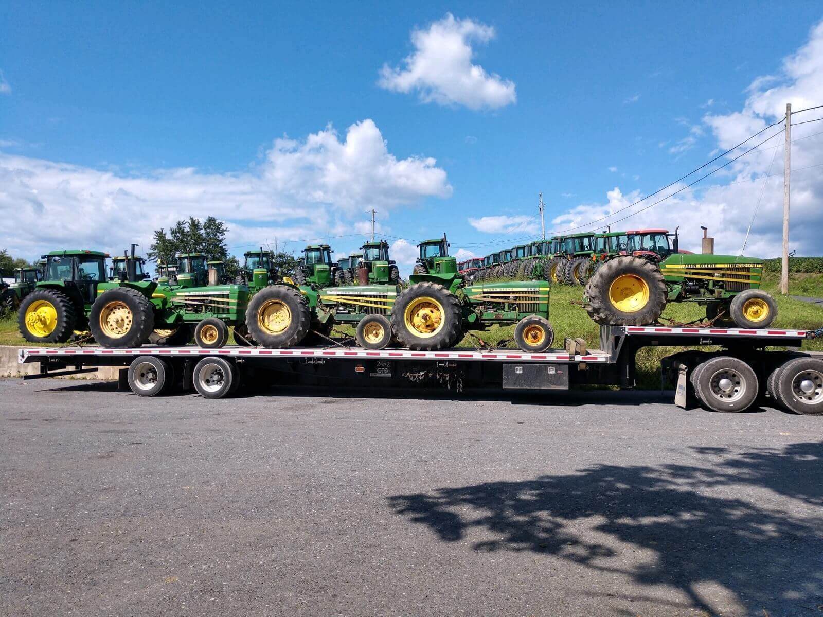 4 John Deere 2640 Tractors transported