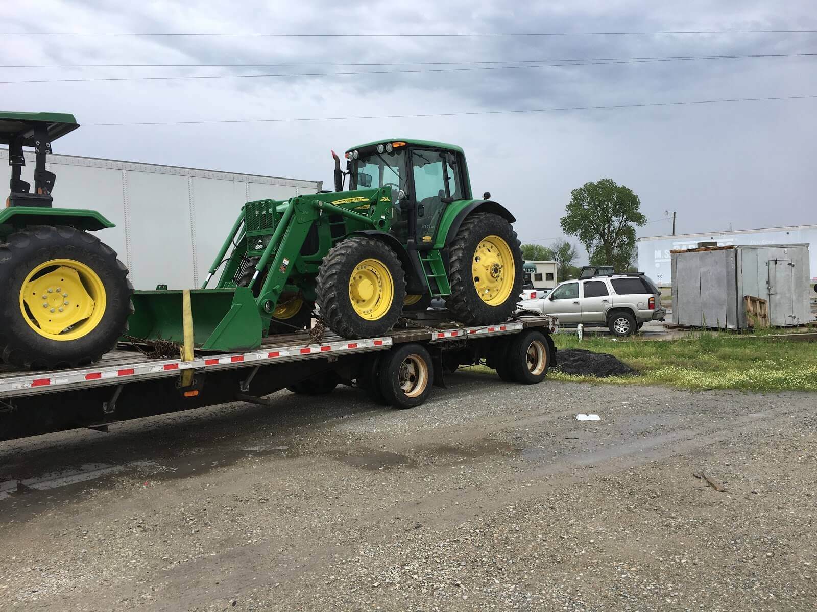 John Deere 7410 Tractor being transported